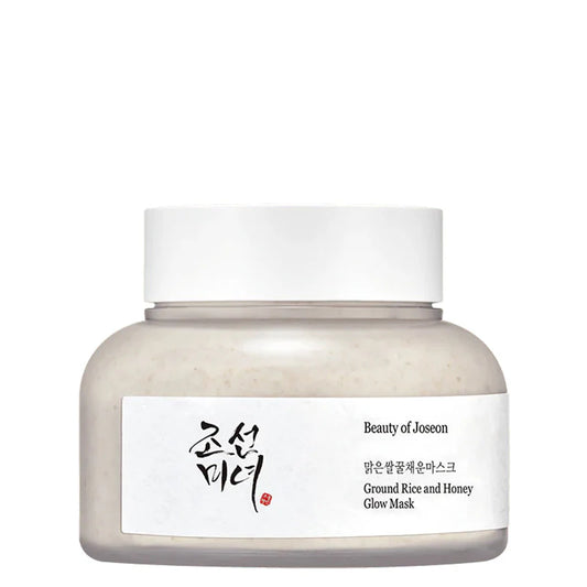 Runde Cremedose mit weißem Deckel, gefüllt mit Reismehl und Honig Glow-Maske.