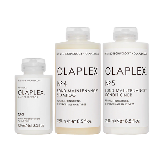 Drei Olaplex-Produkte stehen nebeneinander: Nr. 3, Nr. 4 und Nr. 5. Klare weiße Verpackung mit schwarzer Schrift auf neutralem Hintergrund.