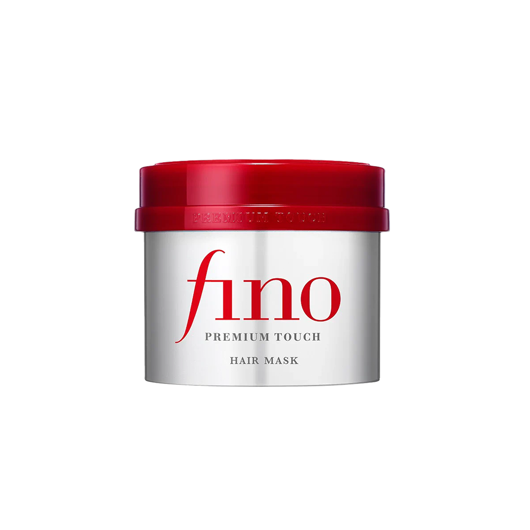 Silberne Dose Hair Mask mit rotem Deckel und schlichtem, modernen Design auf schwarzem Hintergrund.