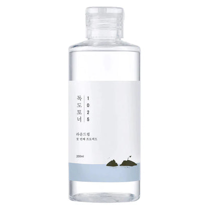 Klare Flasche mit schlichtem Design, 200 ml, weiße Etikette mit minimalistischer Illustration von Felsen.