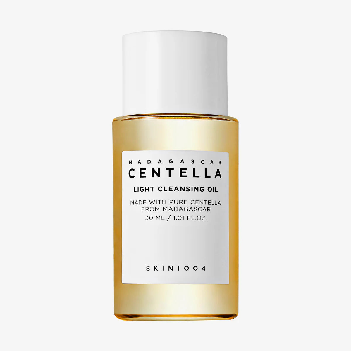 Miniaturflasche des Cleansing Oils mit weißem Deckel, kompaktes Reiseformat.